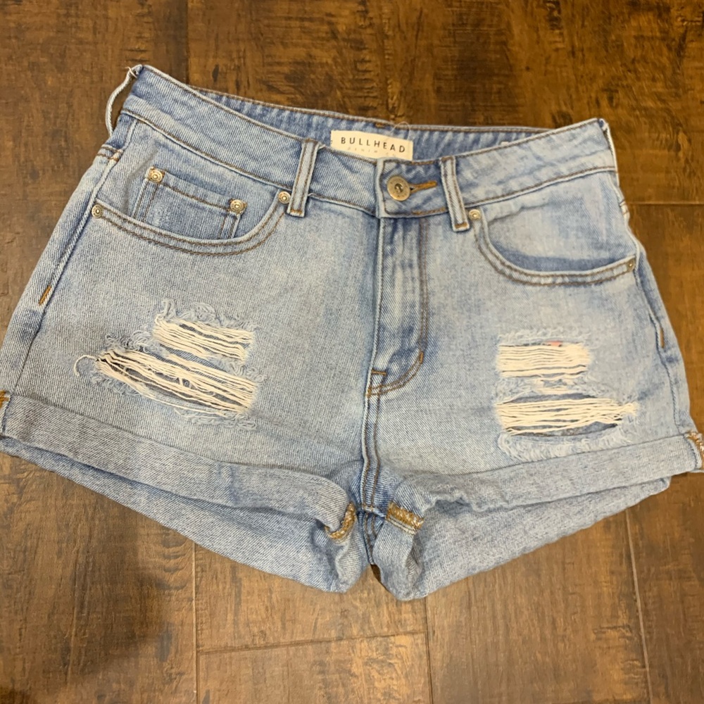 blue ripped denim shorts